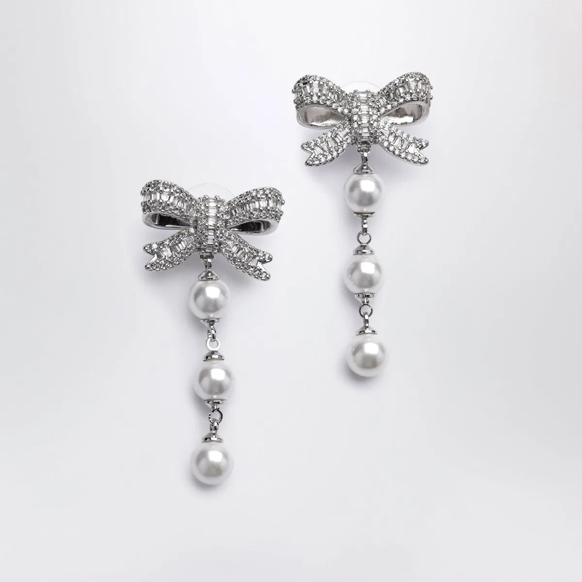 Crystal Bow And Pearl Drop Earrings In Silver